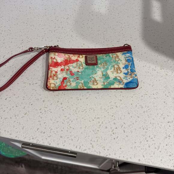 Dooney & Bourke Handbags - Dooney & Bourke Paint Splatter Logo Canvas Slim Wristlet